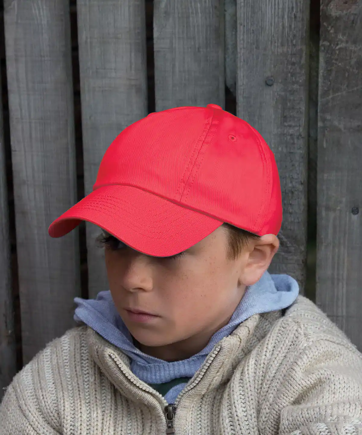Red junior cotton low-profile cap with embroidered branding, perfect for kids' casual wear.