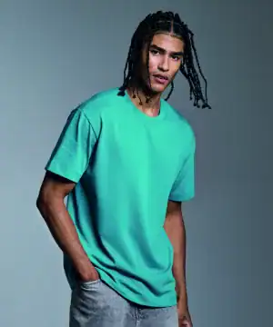 Man wearing a turquoise Anthem heavyweight t-shirt, front view.