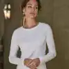 Elegant white long sleeve interlock tee for women, perfect for casual or workwear. Custom embroidery.