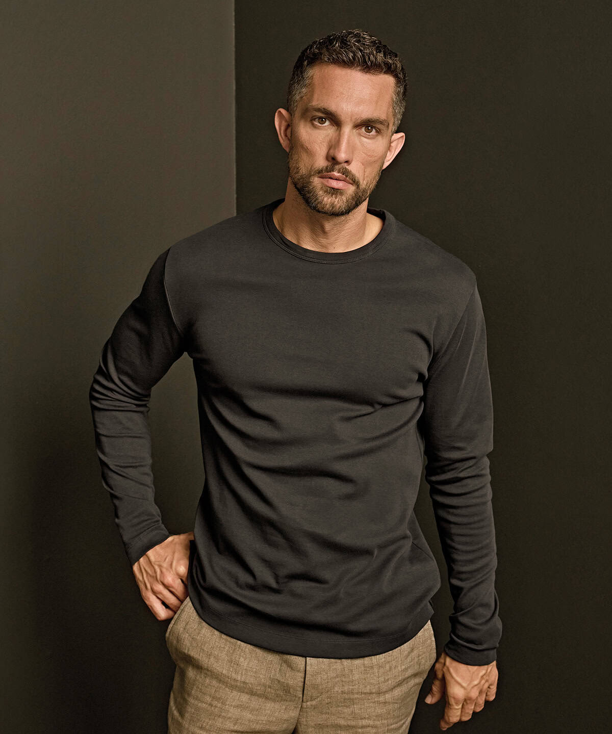 Men's black long sleeve interlock T-shirt for casual wear. Comfortable, durable, and perfect for eve.