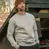 Comfortable grey sweatshirt worn casually in nature setting.
