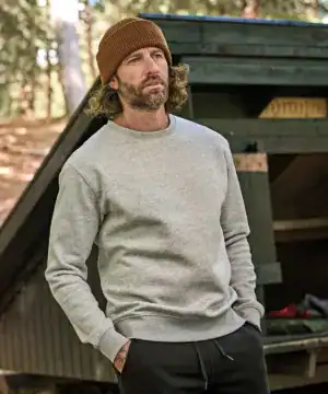 Comfortable grey sweatshirt worn casually in nature setting.
