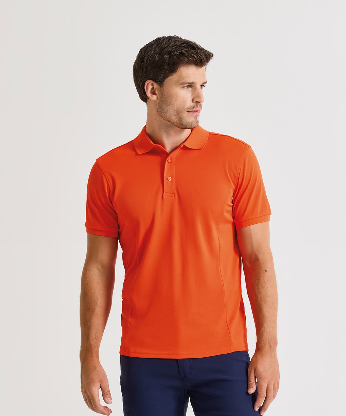 Man wearing bright orange polo shirt with embroidery, casual style.