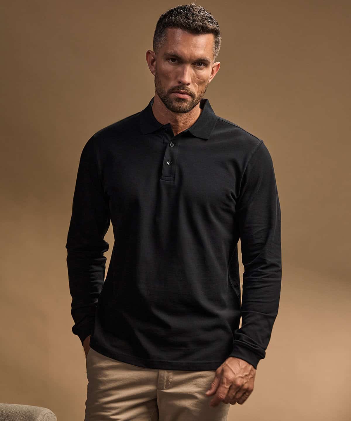 Men's black long sleeve polo shirt with stretch fabric, perfect for casual and smart-casual wear.