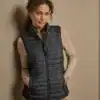Elegant women's crossover bodywarmer with quilted design, perfect for outdoor layering. Custom embro.
